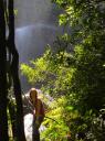 Still playing beneath the waterfall